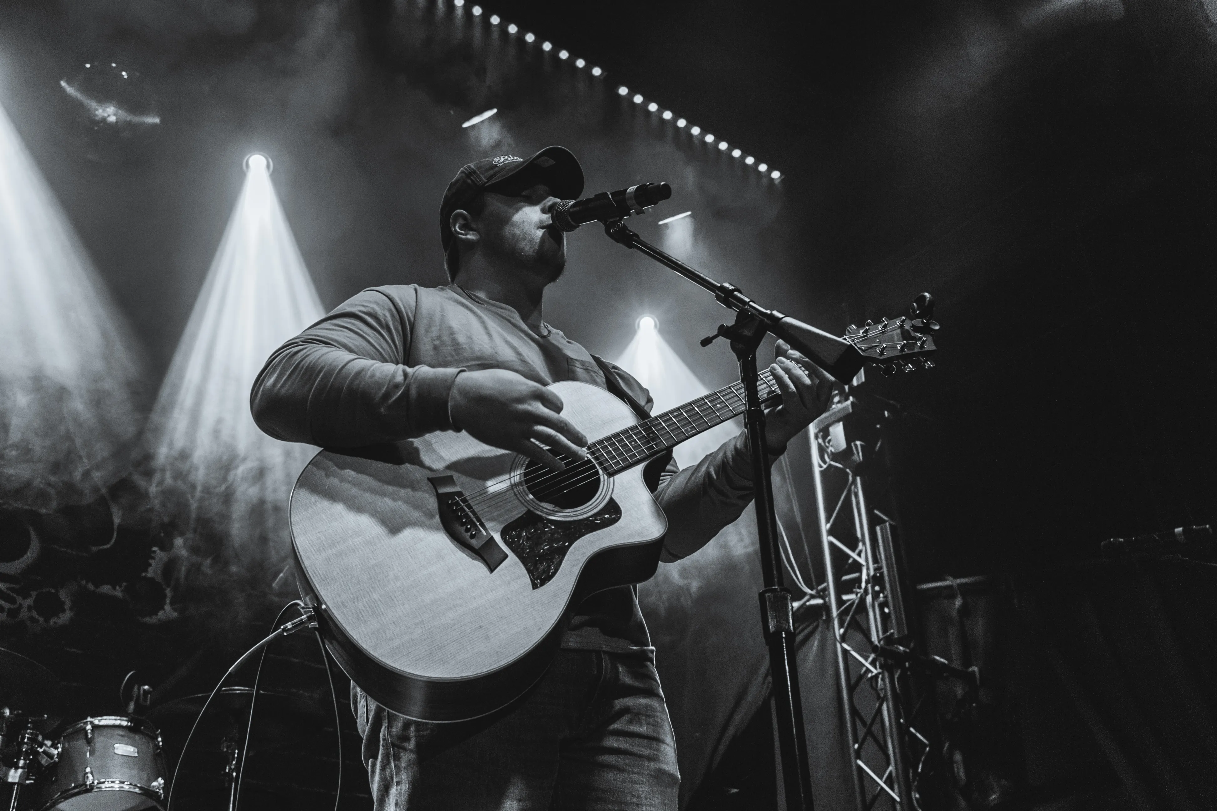 Dylan Cole performing a guitar solo at a live show.